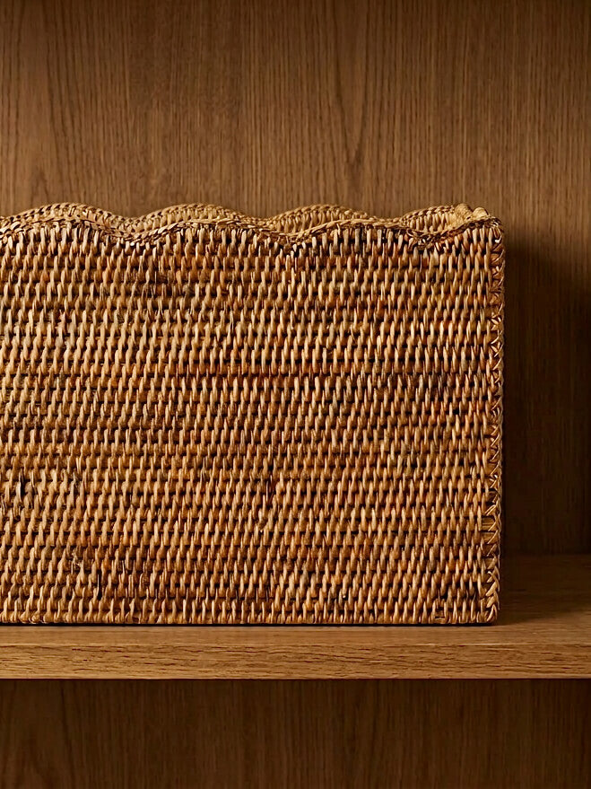 Natural rattan scalloped basket close up showing handwoven texture and decorative edge, Alness storage basket for shelves and home organisation
