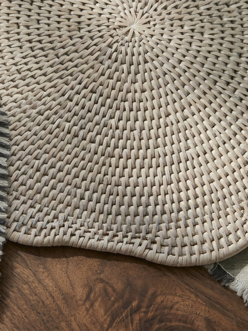 Ayre white scalloped rattan placemat close up showing handwoven texture and edge detail