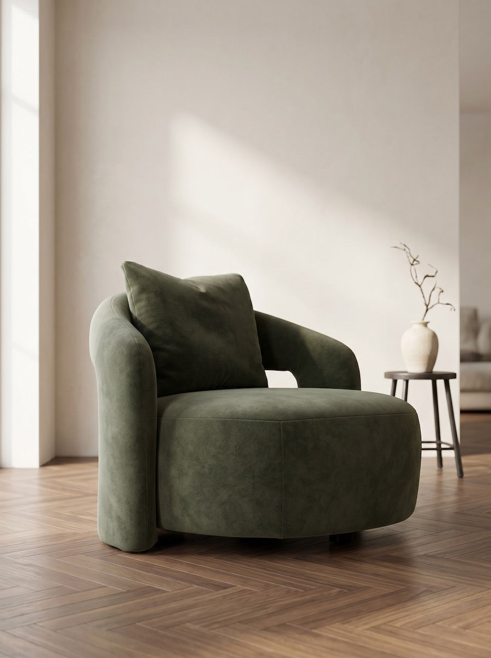 Green armchair in a modern room with wooden floor and neutral walls