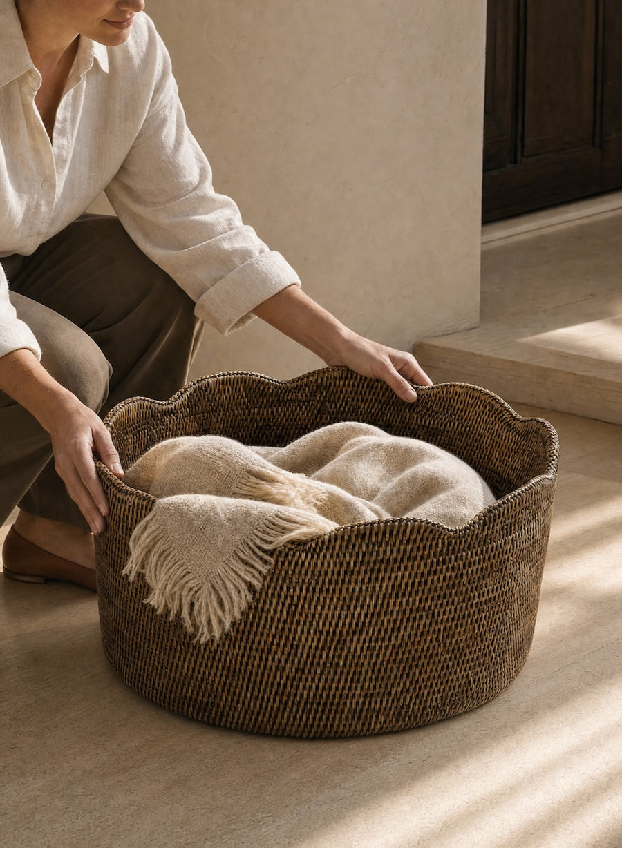 A large woven rattan basket used in the home