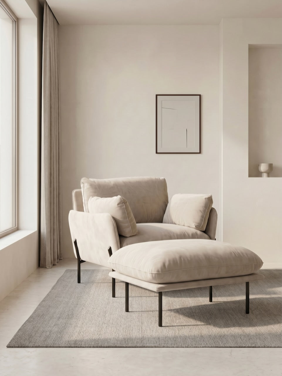 Beige armchair and ottoman in a minimalistic room with a neutral color palette.