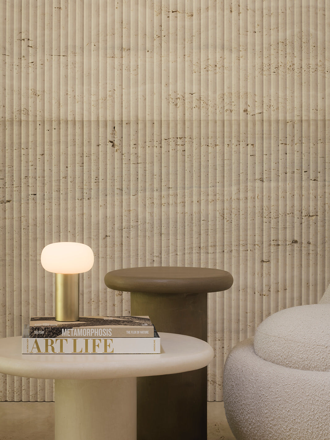 Elba brushed gold rechargeable table lamp styled on side table with books in modern neutral living room cordless dimmable warm light lamp