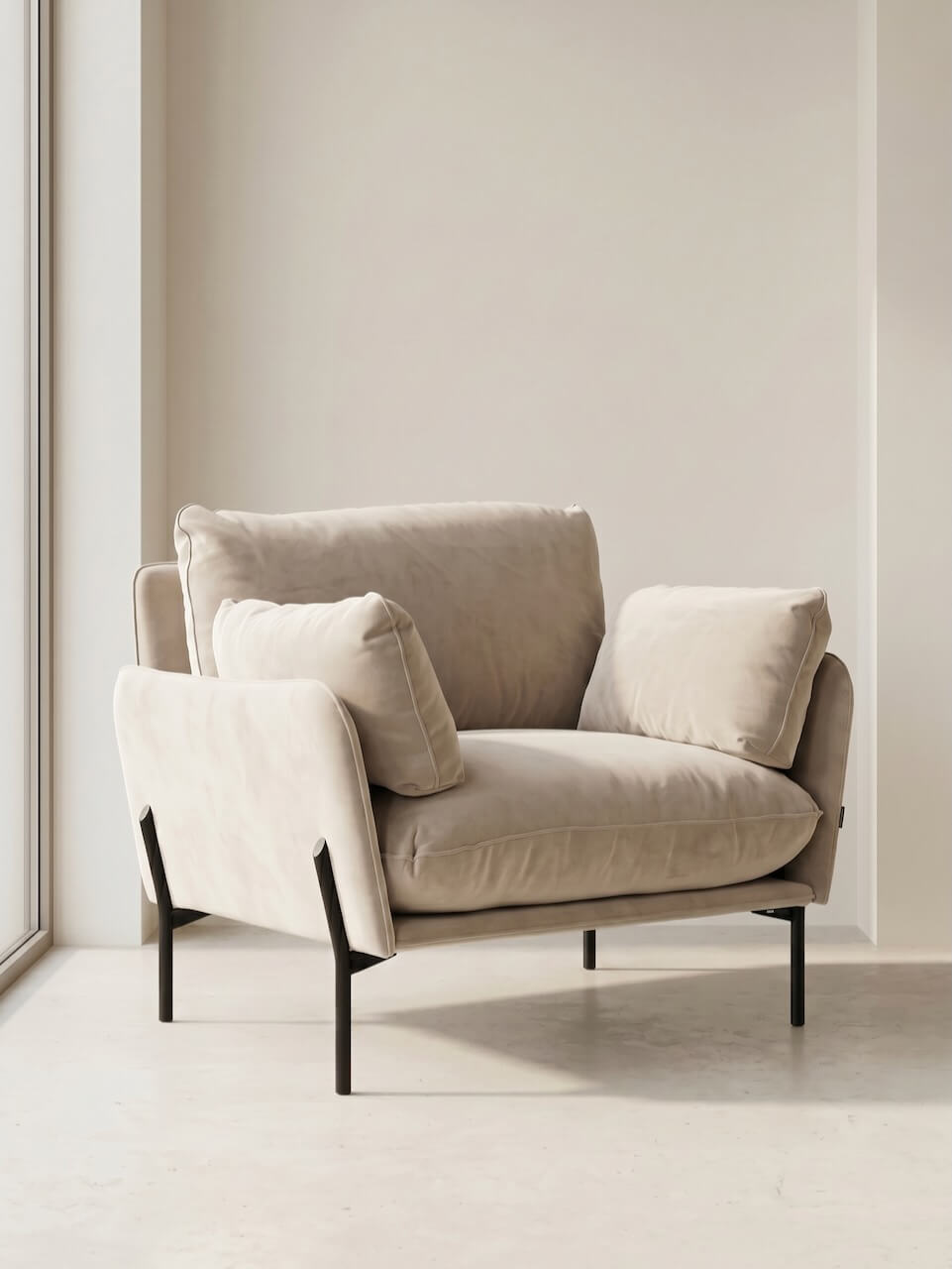 Beige armchair with black legs in a minimalistic room